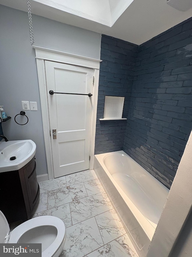 643 Jamestown Ave, Philadelphia, PA 19128 - bathroom featuring marble look tile flooring, vanity, and a tub to relax in