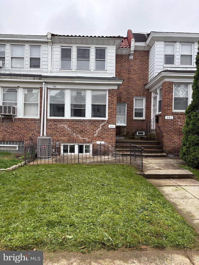 643 Jamestown Ave, Philadelphia, PA 19128 - view of property featuring a fenced front yard and brick siding