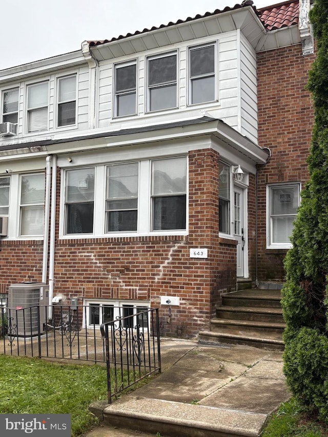 643 Jamestown Ave, Philadelphia, PA 19128 - view of front of home with brick siding, entry steps, and a tiled roof