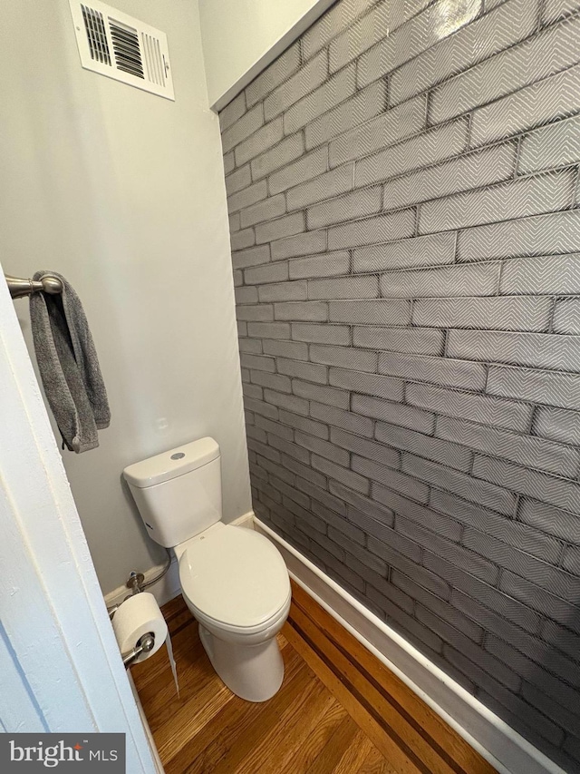 643 Jamestown Ave, Philadelphia, PA 19128 - bathroom featuring wood finished floors and brick wall