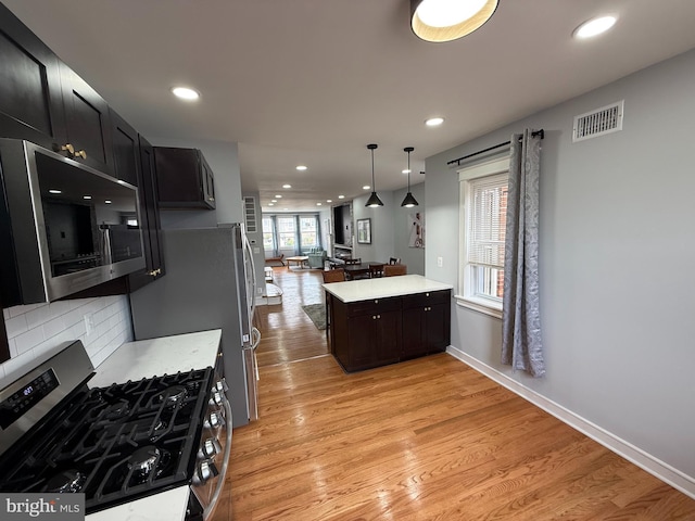 643 Jamestown Ave, Philadelphia, PA 19128 - kitchen featuring stainless steel appliances, light wood finished floors, light countertops, recessed lighting, and decorative backsplash