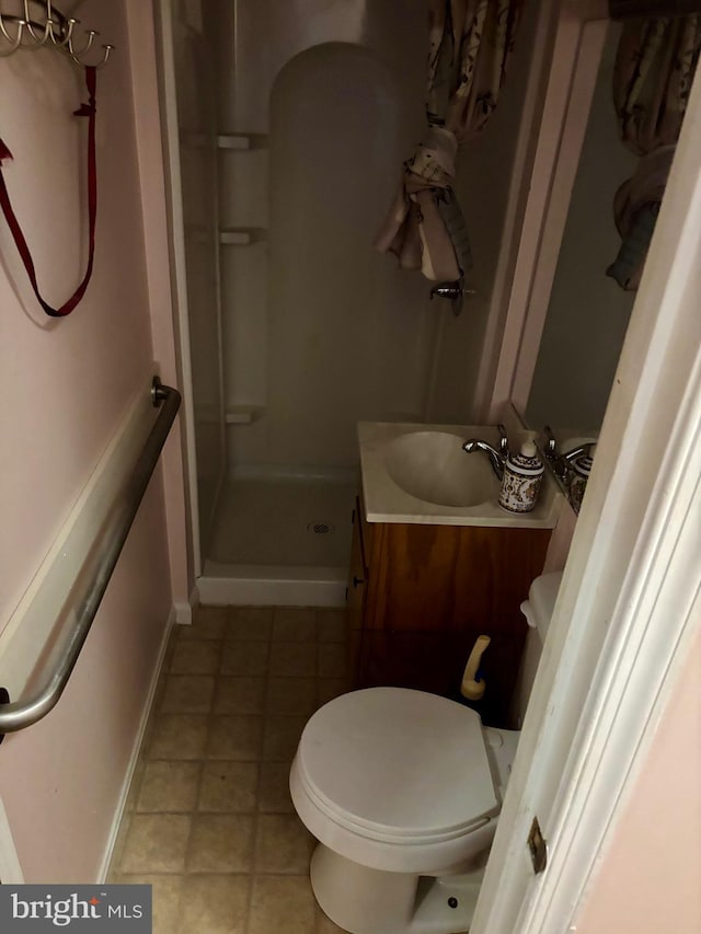 311 Ash Hollow Dr, Winchester, VA 22602 - bathroom featuring a stall shower, vanity, and tile patterned floors