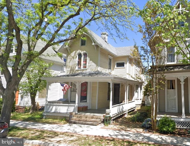 45 S Bradford St, Dover, DE 19904 - view of front facade with a porch and a chimney
