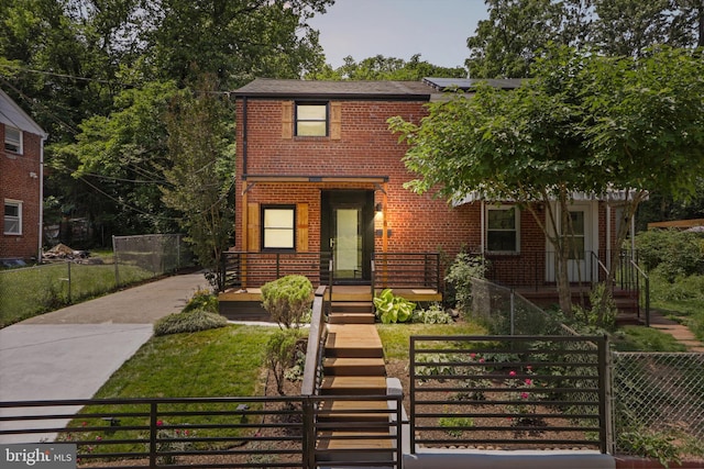 618 Cabin Branch Dr, Capitol Heights, MD 20743 - view of front facade featuring brick siding, a fenced front yard, and driveway