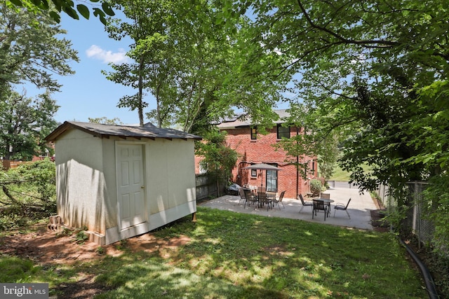 618 Cabin Branch Dr, Capitol Heights, MD 20743 - back of house featuring a fenced backyard, a patio, a shed, and brick siding