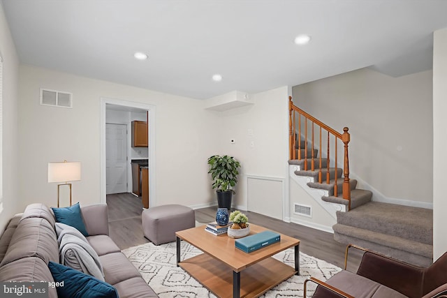 618 Cabin Branch Dr, Capitol Heights, MD 20743 - living area with stairway, wood finished floors, and recessed lighting
