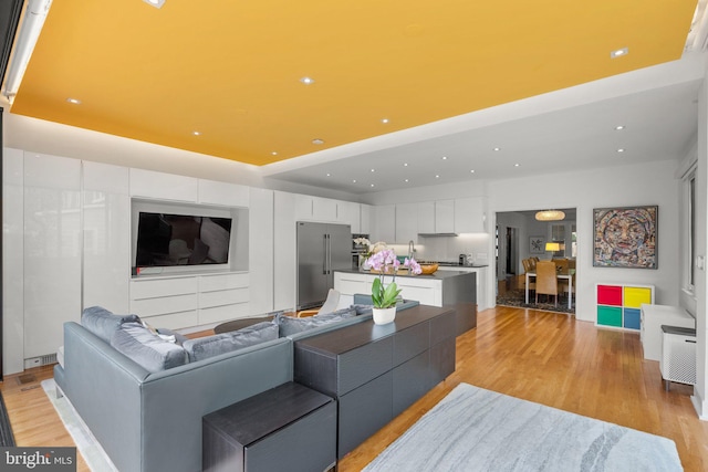 2815 39th St NW, Washington, DC 20007 - living area featuring light wood-style flooring, recessed lighting, and a raised ceiling