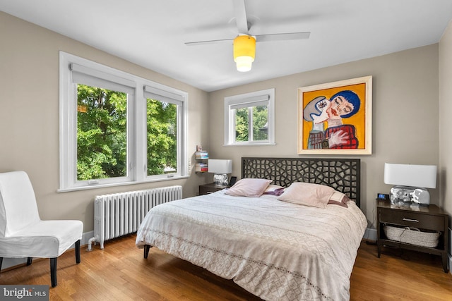2815 39th St NW, Washington, DC 20007 - bedroom featuring radiator, wood finished floors, and ceiling fan