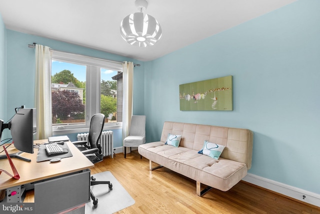 2815 39th St NW, Washington, DC 20007 - office area with wood finished floors, a chandelier, and radiator heating unit