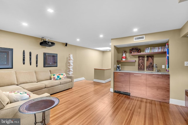 2815 39th St NW, Washington, DC 20007 - living area featuring bar area, light wood-type flooring, and recessed lighting