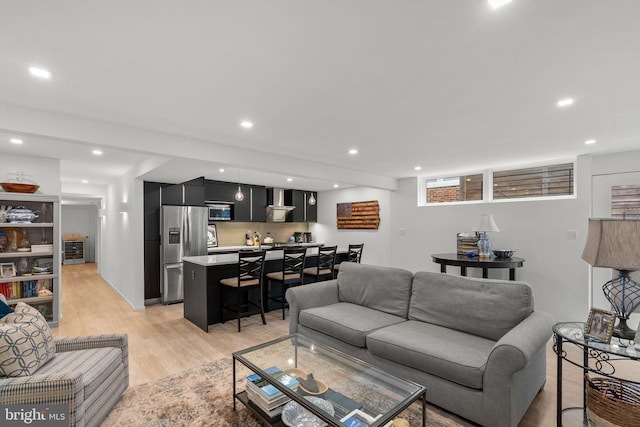 2815 39th St NW, Washington, DC 20007 - living room with light wood-type flooring, wet bar, and recessed lighting
