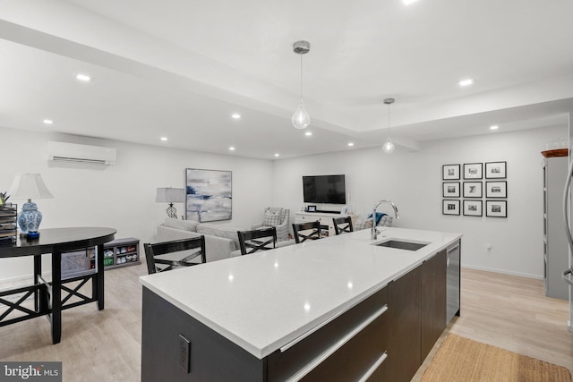 2815 39th St NW, Washington, DC 20007 - kitchen with a wall mounted AC, light wood finished floors, decorative light fixtures, light countertops, and recessed lighting