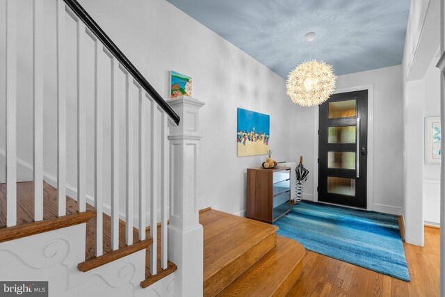 2815 39th St NW, Washington, DC 20007 - foyer entrance with stairway, a chandelier, and wood finished floors