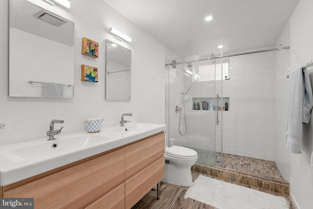 2815 39th St NW, Washington, DC 20007 - full bath featuring a shower stall, double vanity, and wood finished floors