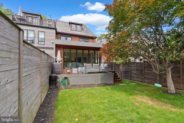 2815 39th St NW, Washington, DC 20007 - back of property with a sunroom, a fenced backyard, mansard roof, and a high end roof