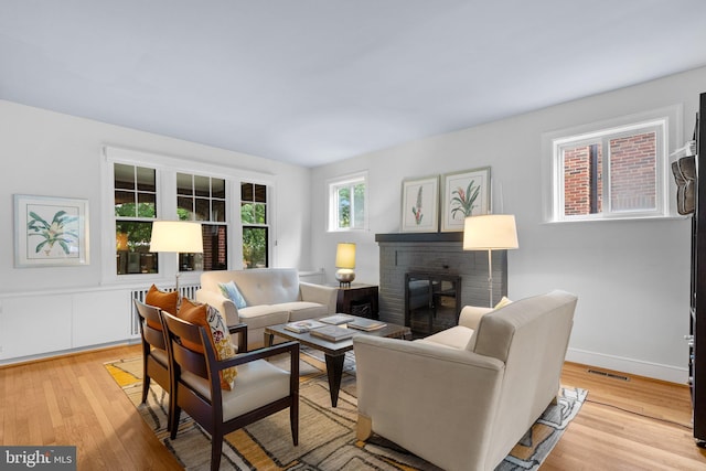 2815 39th St NW, Washington, DC 20007 - living area with a brick fireplace and light wood finished floors
