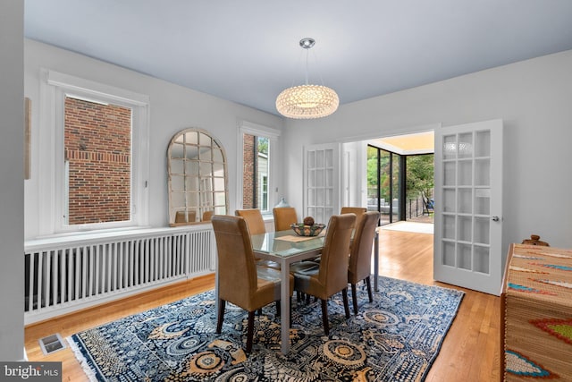 2815 39th St NW, Washington, DC 20007 - dining room with radiator heating unit and wood finished floors