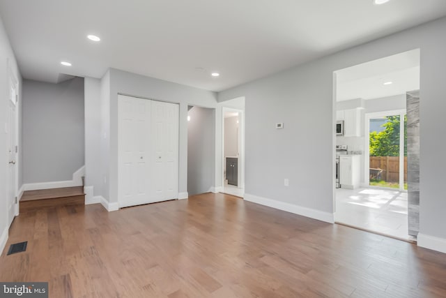 902 Nadine Ct, Landover, MD 20785 - unfurnished bedroom with recessed lighting, light wood-style flooring, access to outside, a closet, and connected bathroom