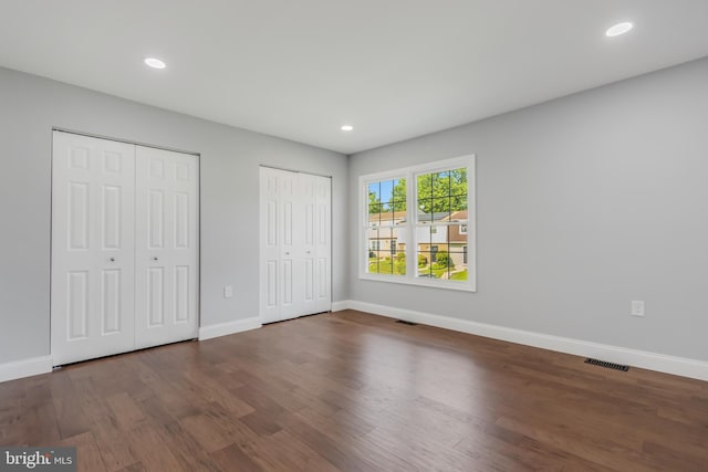 902 Nadine Ct, Landover, MD 20785 - unfurnished bedroom with two closets, wood finished floors, and recessed lighting