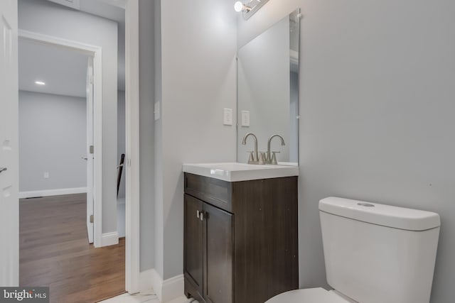 902 Nadine Ct, Landover, MD 20785 - half bathroom with vanity, wood finished floors, and recessed lighting
