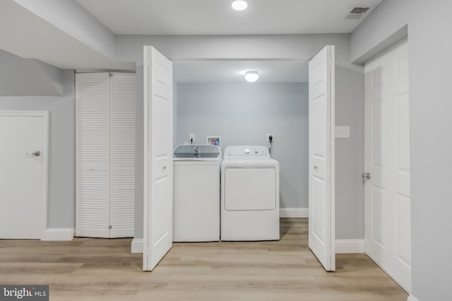 902 Nadine Ct, Landover, MD 20785 - laundry area with separate washer and dryer, light wood-style flooring, and recessed lighting