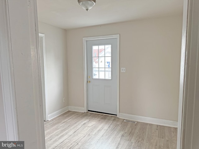 112 Dorman St, Harrington, DE 19952 - doorway to outside with light wood-style floors and baseboards