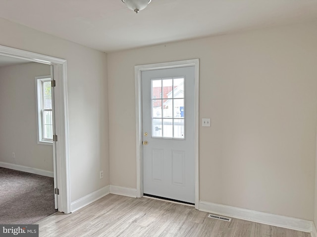 112 Dorman St, Harrington, DE 19952 - doorway to outside with light wood-style flooring and baseboards