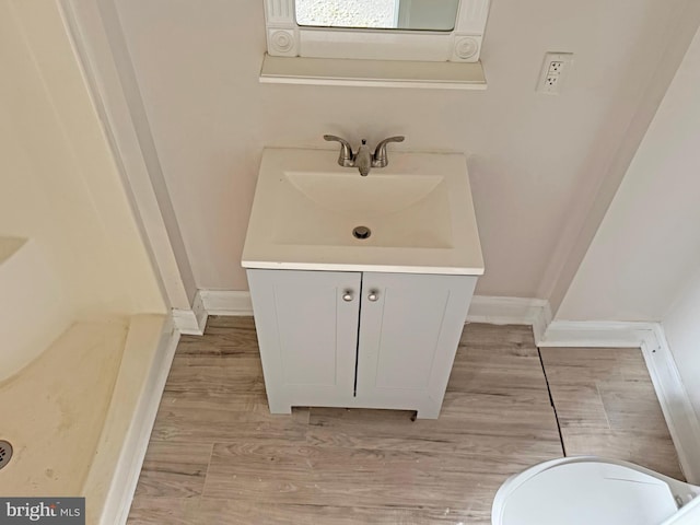 112 Dorman St, Harrington, DE 19952 - bathroom featuring vanity and wood finished floors