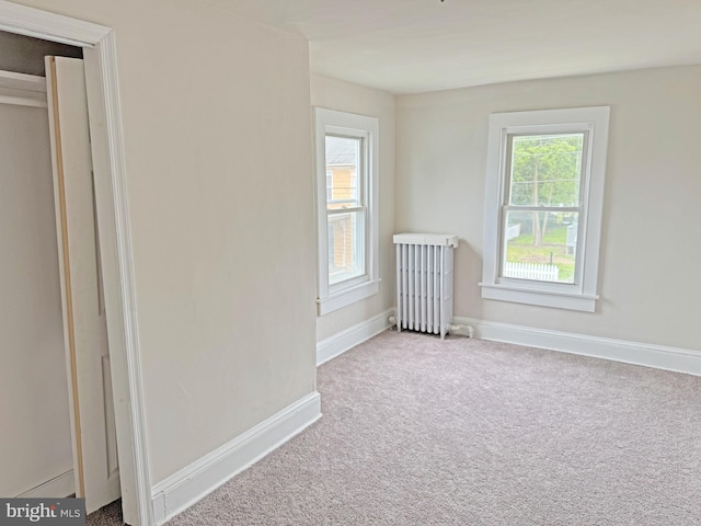 112 Dorman St, Harrington, DE 19952 - unfurnished room with carpet and radiator heating unit