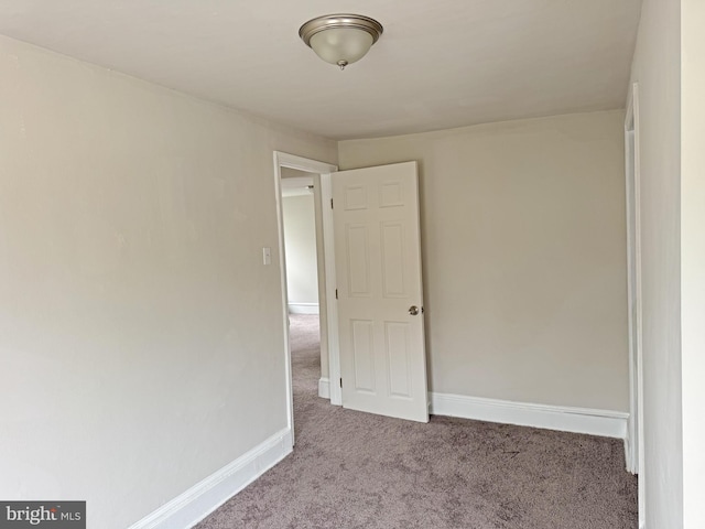 112 Dorman St, Harrington, DE 19952 - carpeted empty room with baseboards