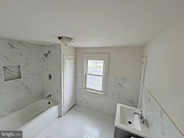 112 Dorman St, Harrington, DE 19952 - bathroom with vanity, bathtub / shower combination, a wainscoted wall, tile walls, and tile patterned floors