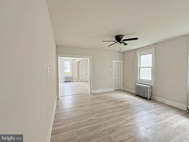 112 Dorman St, Harrington, DE 19952 - spare room with radiator, ceiling fan, and light wood-type flooring