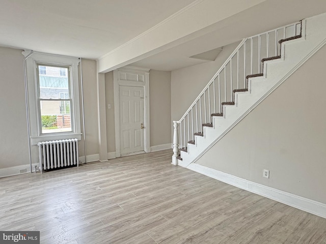 112 Dorman St, Harrington, DE 19952 - entrance foyer featuring radiator, stairway, and wood finished floors