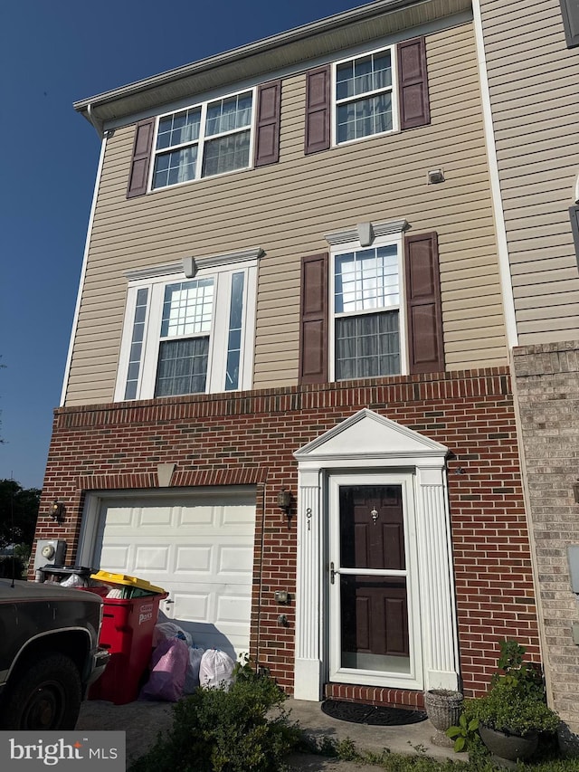 81 Truth Way, Martinsburg, WV 25405 - townhome / multi-family property featuring brick siding and an attached garage