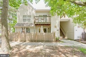 1043 Tristram Cir, Mantua, NJ 08051 - rear view of house featuring a balcony and stairs
