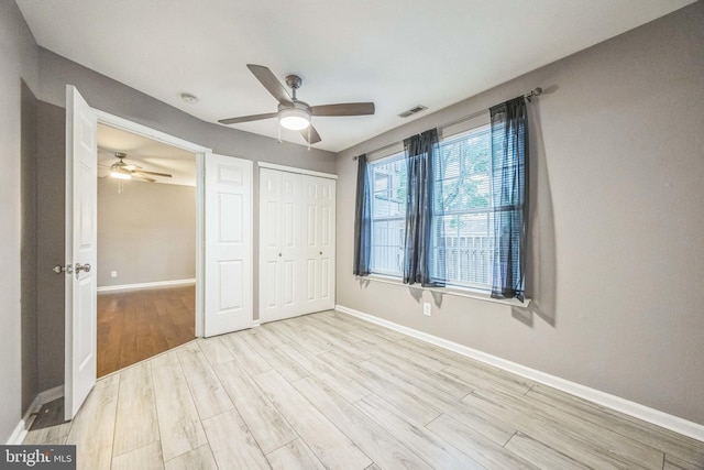 1043 Tristram Cir, Mantua, NJ 08051 - unfurnished bedroom featuring wood finished floors, a closet, and a ceiling fan