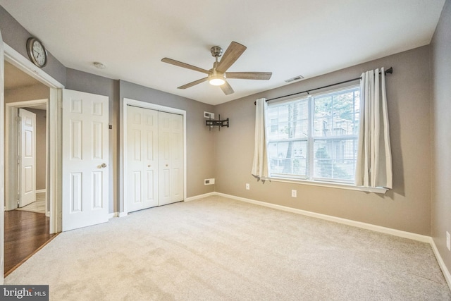 1043 Tristram Cir, Mantua, NJ 08051 - unfurnished bedroom featuring carpet, a closet, and a ceiling fan