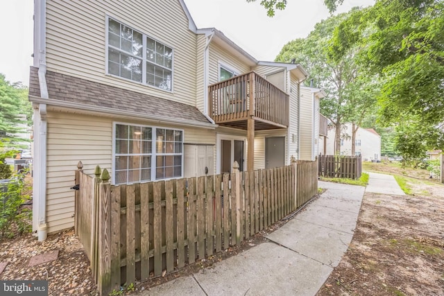 1043 Tristram Cir, Mantua, NJ 08051 - rear view of property featuring a balcony and a shingled roof