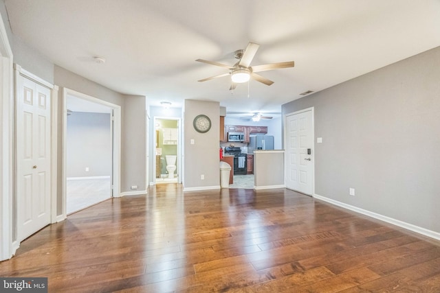 1043 Tristram Cir, Mantua, NJ 08051 - unfurnished living room featuring a ceiling fan and dark wood finished floors