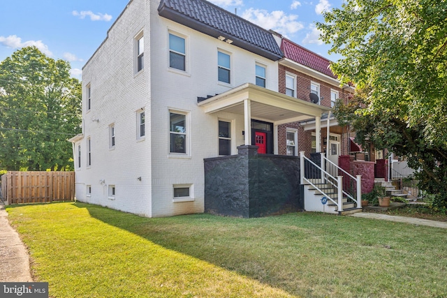 4219 Granada Ave, Baltimore, MD 21215 - townhome / multi-family property featuring brick siding and covered porch