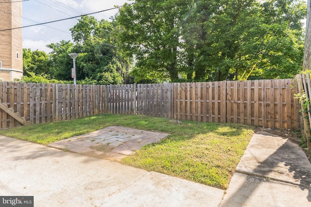 4219 Granada Ave, Baltimore, MD 21215 - fenced backyard with a patio area
