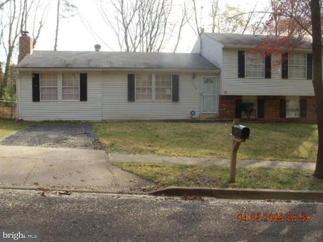 12518 Tove Rd, Clinton, MD 20735 - split level home with a front yard and a chimney