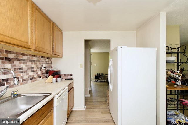 12518 Tove Rd, Clinton, MD 20735 - kitchen featuring white appliances, light wood-type flooring, tasteful backsplash, light countertops, and light brown cabinetry