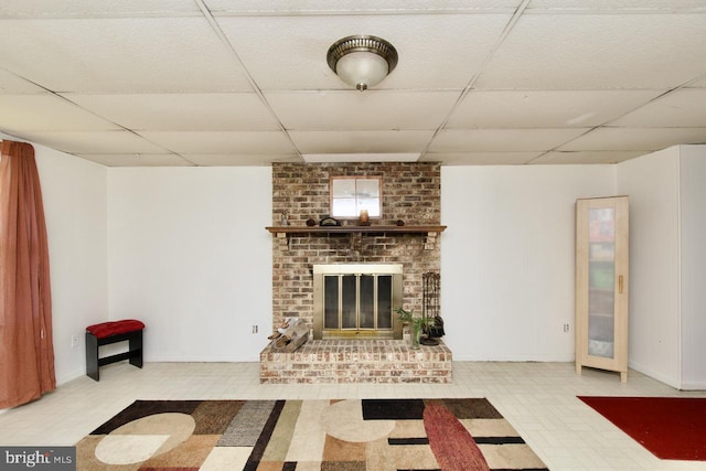 12518 Tove Rd, Clinton, MD 20735 - unfurnished living room with a drop ceiling and a brick fireplace