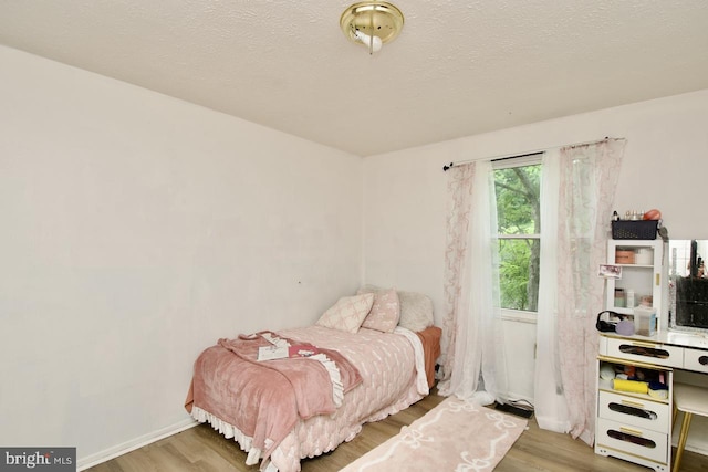 12518 Tove Rd, Clinton, MD 20735 - bedroom with wood finished floors and a textured ceiling