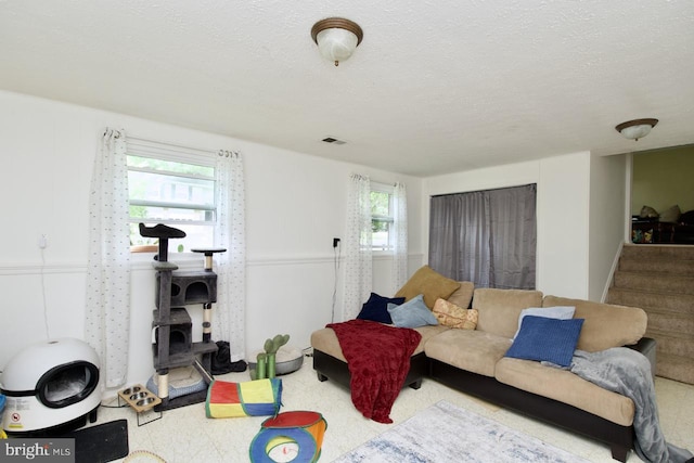 12518 Tove Rd, Clinton, MD 20735 - living room featuring stairway and a textured ceiling