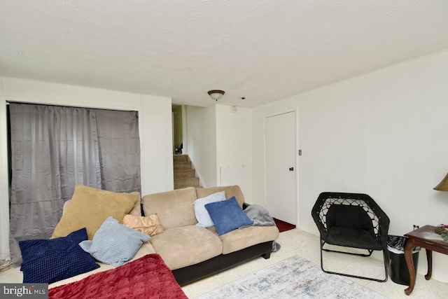12518 Tove Rd, Clinton, MD 20735 - carpeted living area with stairway and a textured ceiling
