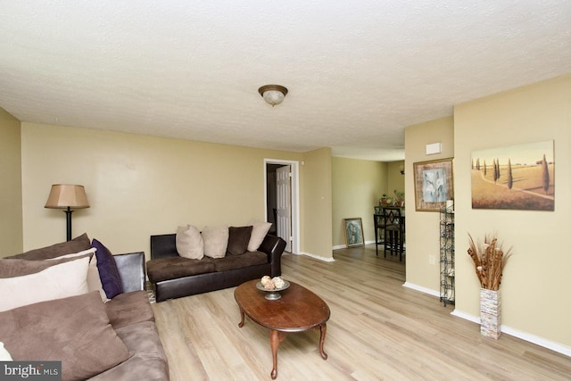12518 Tove Rd, Clinton, MD 20735 - living room featuring wood finished floors and a textured ceiling