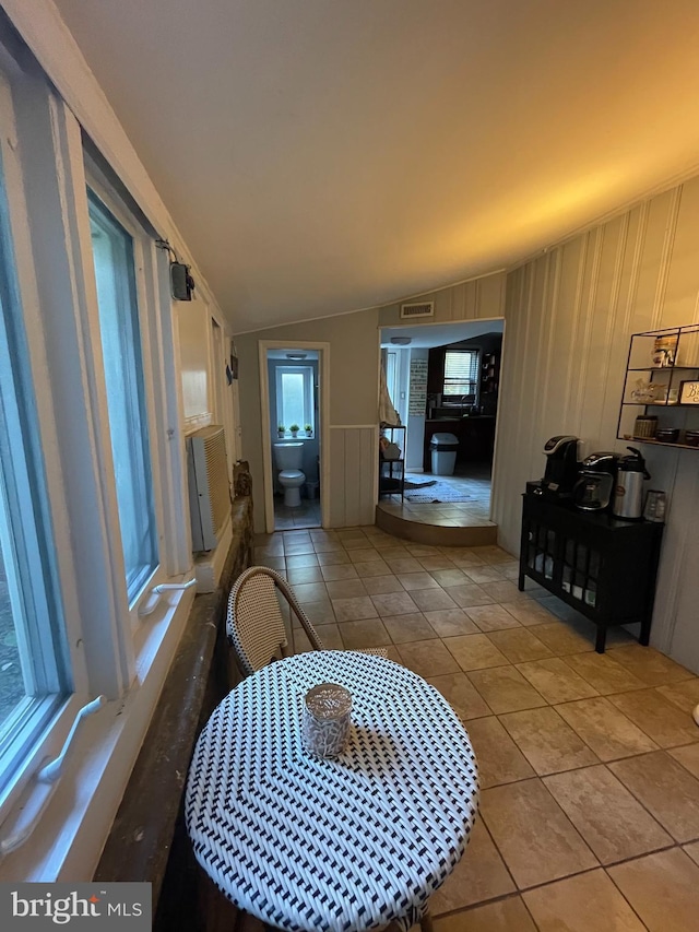 7301 Granite Rd, Elkins Park, PA 19027 - corridor with lofted ceiling, tile patterned floors, a decorative wall, and cooling unit
