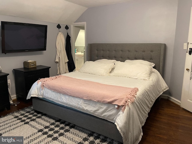 7301 Granite Rd, Elkins Park, PA 19027 - bedroom with wood finished floors, vaulted ceiling, and connected bathroom